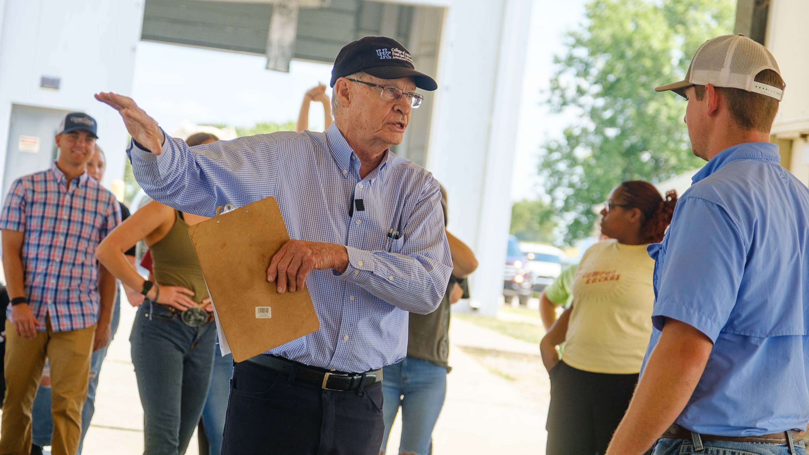 Don Ely guiding students in the barn at the C. Oran Little Research Farm.