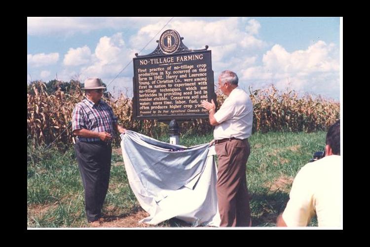 Harry Young and Shirley Phillips unveiling the No-Tillage Historical Marker on Young's farm. Photo courtesy of John Young.