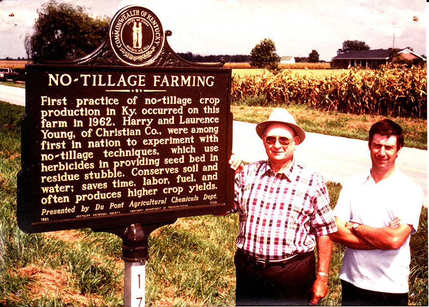 Harry Young and John Young by the No-Till Birthplace Historical Marker on the Youngs' farm. Photo courtesy of Alexander Young.