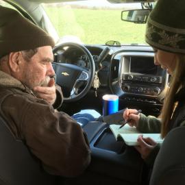 Richard Preston and Hanna Poffenbarger go over data from field trials in pre-pandemic times. Photo by Chad Lee