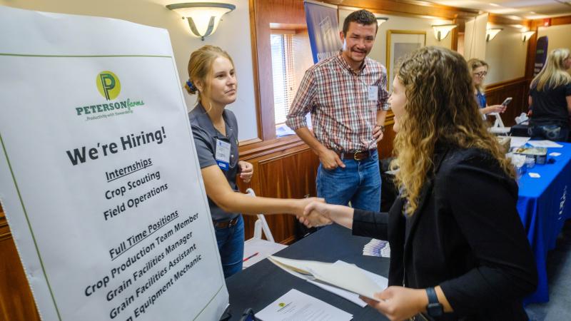 UK student shaking hands at the 2023 Agribusiness &amp; Industry Career Fair, held in Gorham Hall in the E.S. Good Barn.