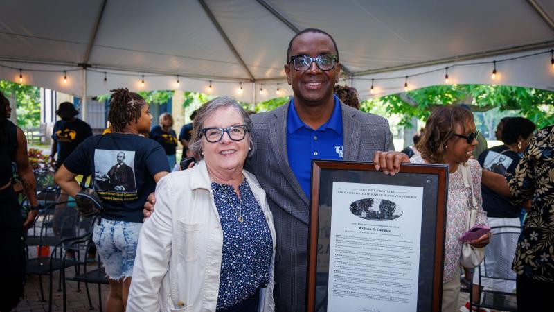 Dean Nancy Cox and Jim Coleman pictured with the William D. Coleman framed resolution. Photo by Matt Barton.