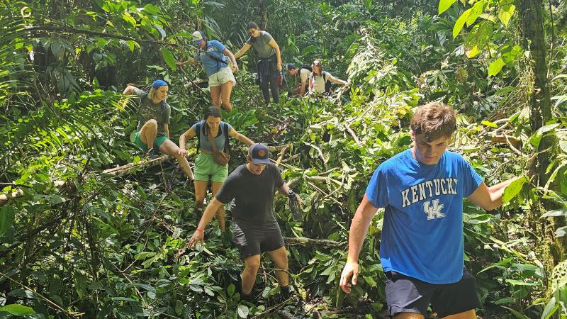 Students traversing Costa Rican forest.