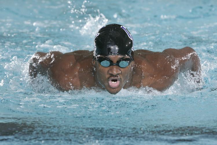 Elvis Burrows Jr., former Olympian and UK swimmer, graduates May 10 with a master's degree in hospitality and dietetic administr