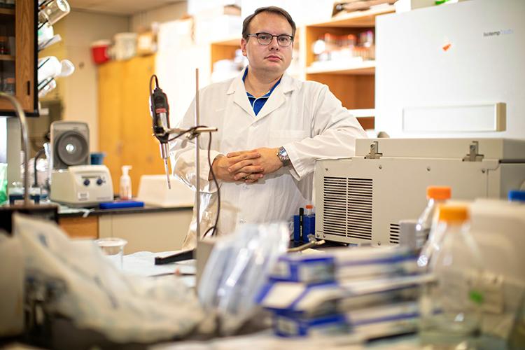 Stuart Lichtenberg, pictured in his lab at the Agriculture Science Center North, will graduate Dec. 20 with a Ph.D. in integrated plant and soil science. Mark Cornelison | UK Photo.