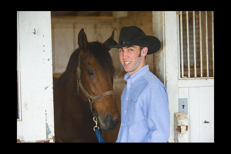 UK student Colton Woods works with horses at UK's Maine Chance Farm. 