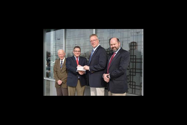 Lloyd’s of London recently presented UK representatives with a $50,000 check.