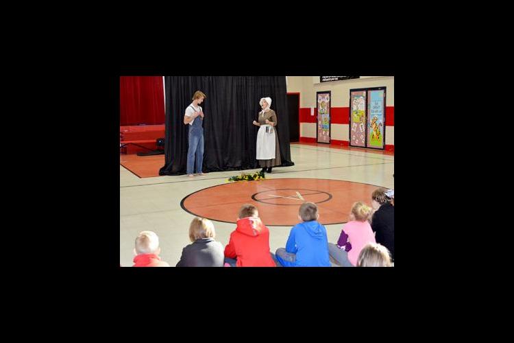 Eli Raby, left, and Anne Stephens act out a scene from Jesse Stuart's "Old Ben" for Argillite Elementary third-graders.