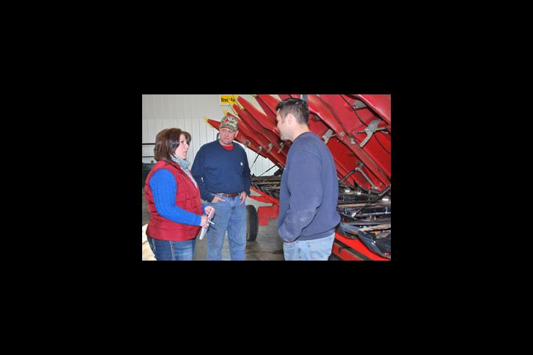 Suzy Martin talks with her Kentucky Farm Business Management clients Richard Strode, center, and Jason Strode. 