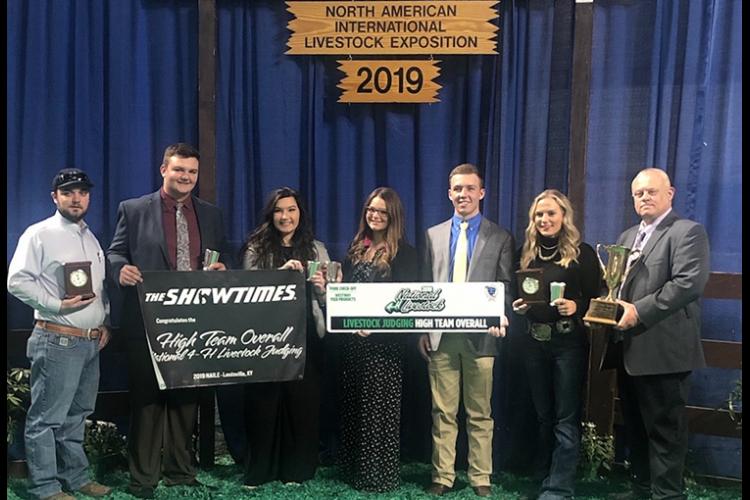 Kentucky 4-H'ers starting second from left: Will Banks, Lydia Gosney, Chevy Vaske and Kasey Johnson won the state's first ever National 4-H Livestock Judging Competition. They are coached by Steve Austin, right.