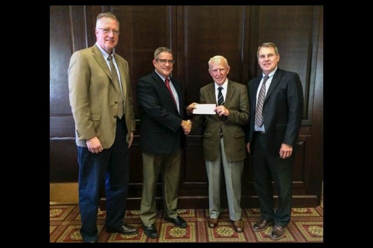 (l-r) David Horohov, Pat Talley, Peter Timoney, Rick Bennett. Talley presents Timoney with check from Lloyd's of London. 