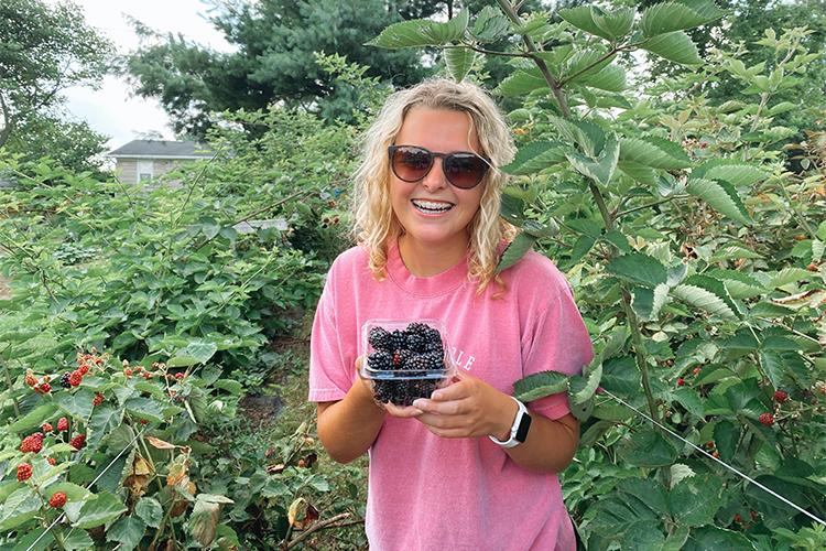 UK student Lucinda Smith, a senior from Corbin, has participated in research and outreach projects that show the health benefits of blackberries to people, who live near Superfund sites. Photo submitted
