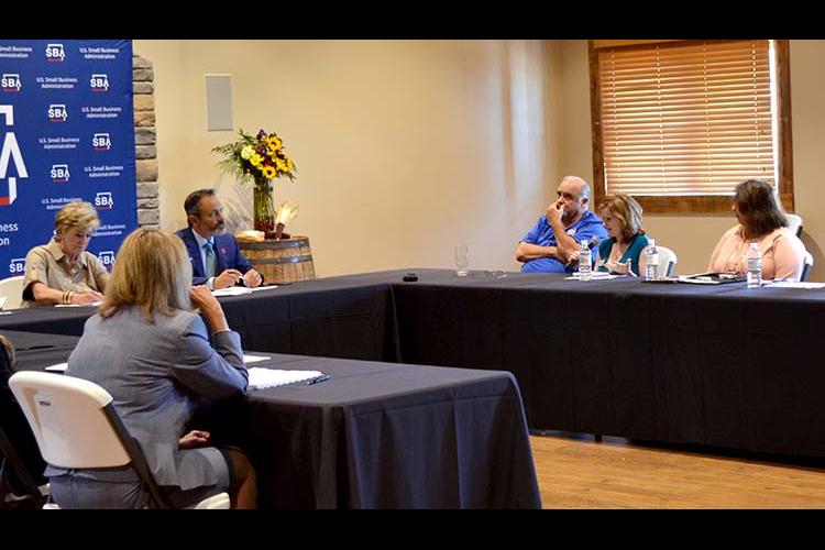 Rhonda Hatfield, owner/founder of Blue Halo Med Spa, speaks to SBA Administrator Linda McMahon and Gov. Matt Bevin during McMahon's recent stop in the state. Photo by: Natalie Cunningham, KSBDC marketing and promotions specialist. 