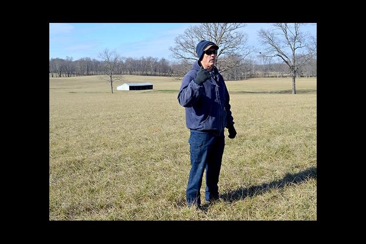 Anderson County producer Mike Wilson talks about his hayfield seeded in novel endophyte tall fescue, which is in the background. 