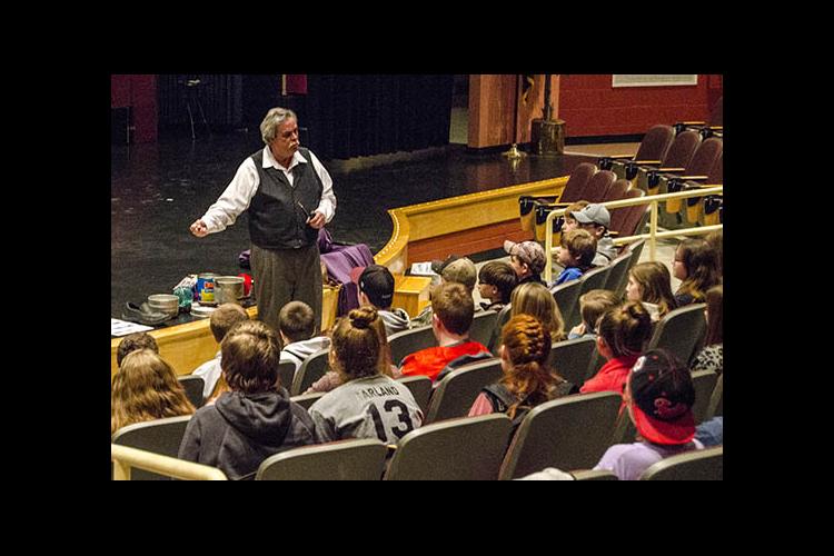 Stephen Hollen weaves his tales for middle-schoolers in Elliott County. 
