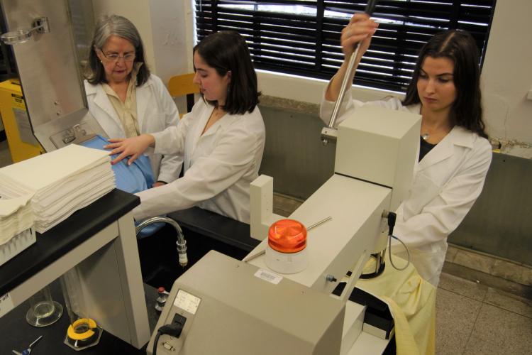 UK students performing experiments in the Textile Lab.