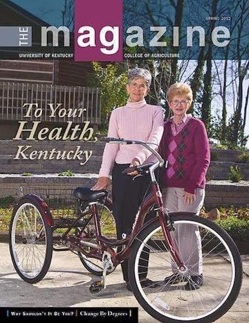 Cover of the AgMagazine for Spring 2012. Cover photo displays two women standing in front of a bike.