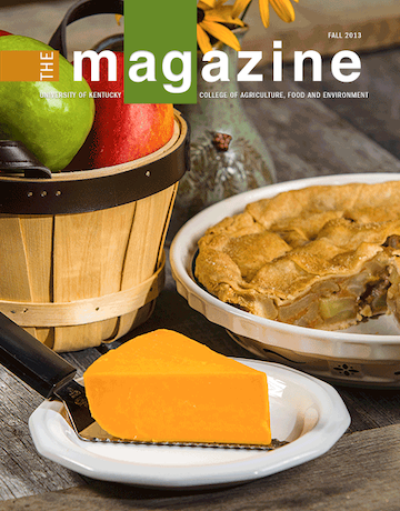 Cover of the AgMagazine for Fall 2013. Cover photo displays a plate with cheese, an apple pie, and a basket of apples.
