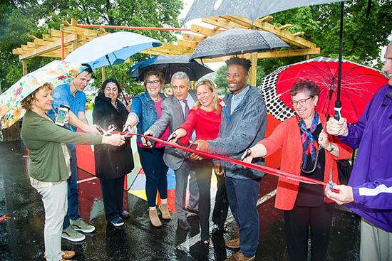 The ribbon is cut on Rakeem Bradshaw's pop-up installation on Southland Drive in Lexington. 