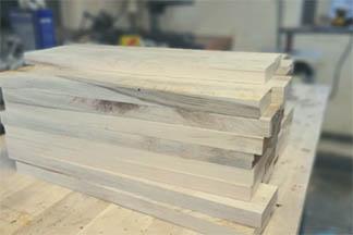A stack of sweetgum lumber that has been planed and cut