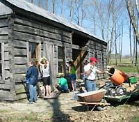 people cleaning cabin exterior