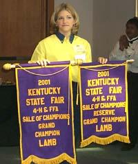 Donna Hancock of Pulaski Co. displays her banners for grand and reserve champion market lambs.