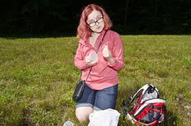 student with insect sample