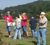4-H members attempt to determine the slope of a site as part of the state 4-H land judging contest.