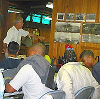 Scholars receive instruction from Carroll Fackler at Robinson Station.