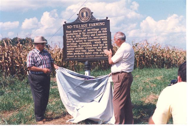 Harry Young Jr, left, and Shirley Phillips unveil the No-Tillage Farming historical marker on Young's farm in 1985. 
